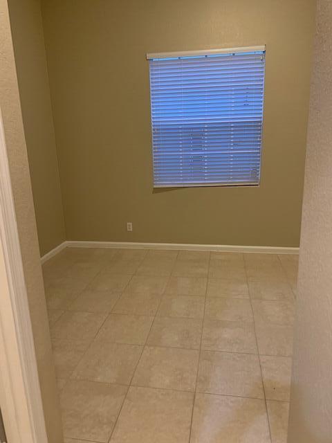 6729 Bulrush Court Greenacres, FL 33413 - Photo 8 of 35 a view of a small space with wooden floor and a window