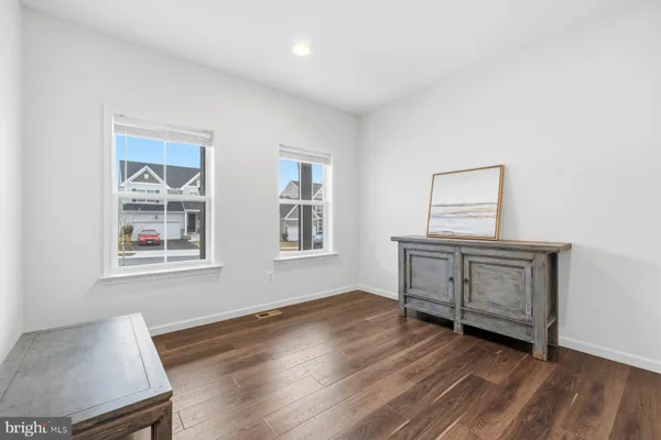 a room with chair and window