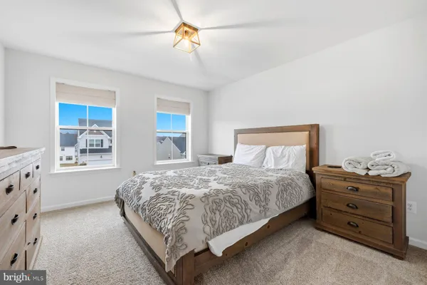 a bedroom with a bed and a dresser