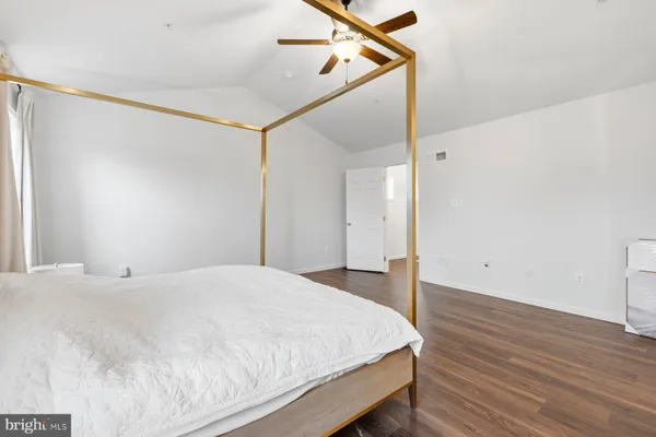 a large white bed in a white room