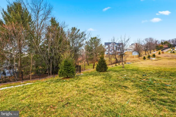 a view of swimming pool with an outdoor space and seating area