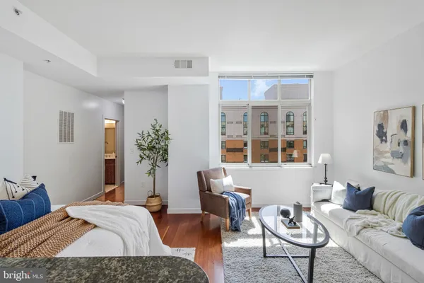 a bedroom with bed and a couch