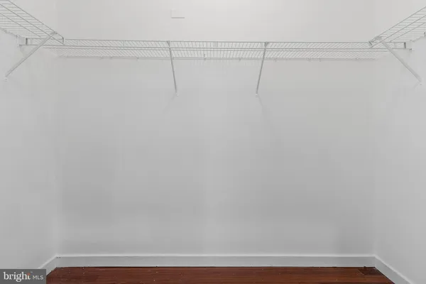 a bathroom with a sink a toilet a mirror a vanity and shower