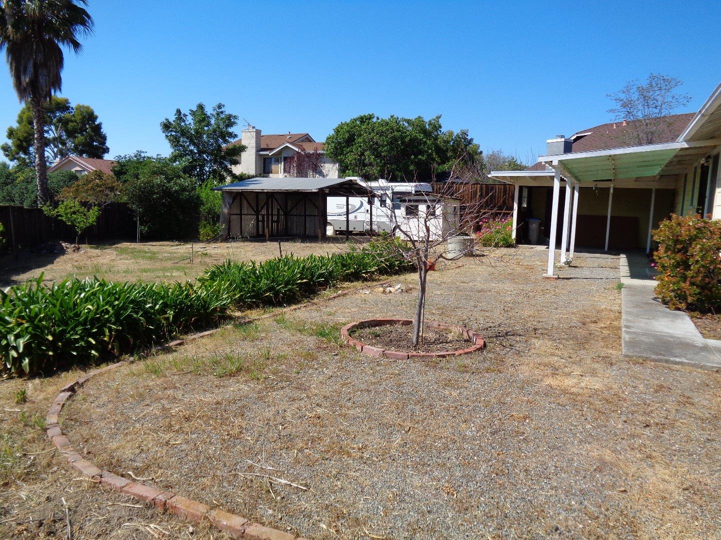 2739 Klein Road San Jose, CA 95148 - Photo 19 of 23 a front view of a house with a yard and potted plants