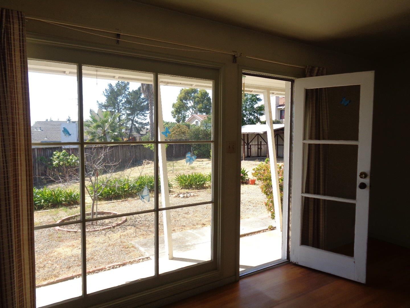 2739 Klein Road San Jose, CA 95148 - Photo 10 of 23 a view of empty room with wooden floor and a window