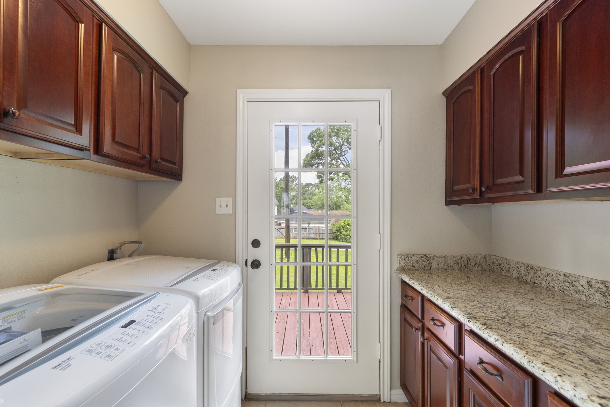 49 April Village Conroe, TX 77356 - Photo 16 of 46 a utility room with a sink washer and dryer