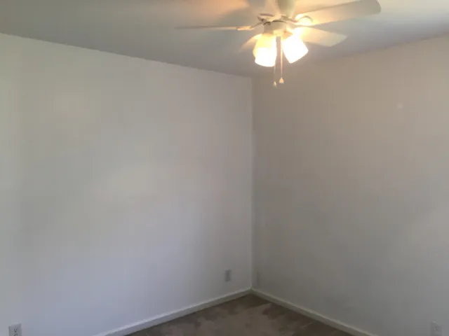 a view of a chandelier fan in a room