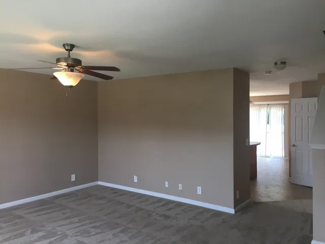 a view of an empty room with a bathroom