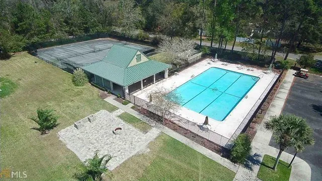 an aerial view of a house with a swimming pool