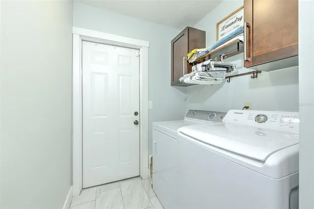 a dining room with a table and chairs