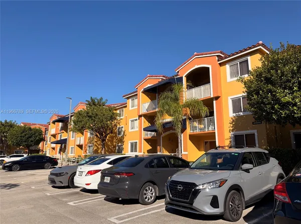 a front view of a house with parking space