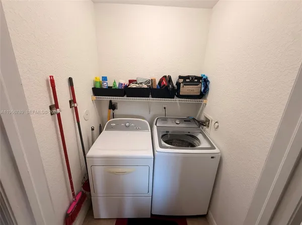 a utility room with dryer and washer