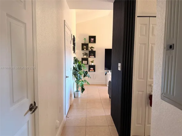 a view of a hallway with a dining room