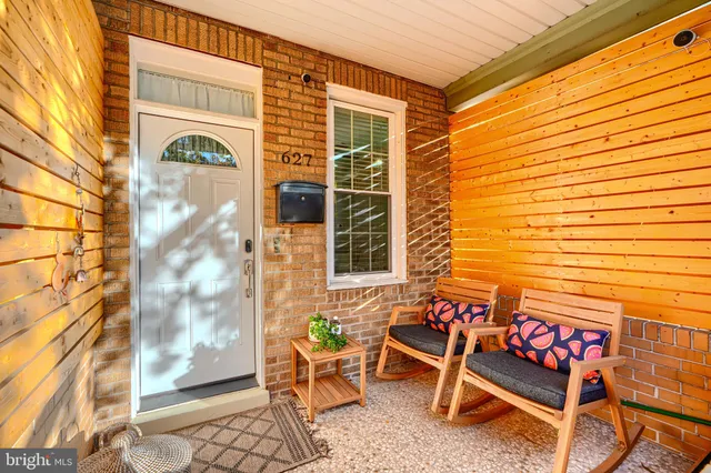 a bench is sitting in front of a door