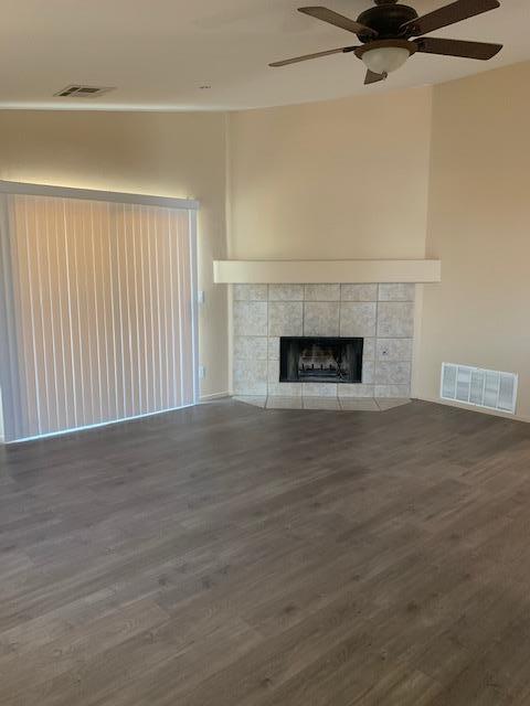 66844 8th Street Desert Hot Springs, CA 92240 - Photo 4 of 6 a view of empty room with wooden floor and fireplace