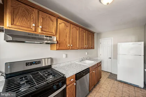 a kitchen with a stove and a sink