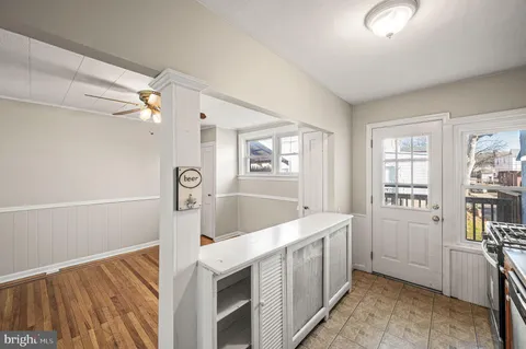 a view of front door and hallway with windows