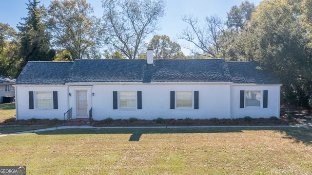 a view of a swimming pool with an outdoor space and seating area
