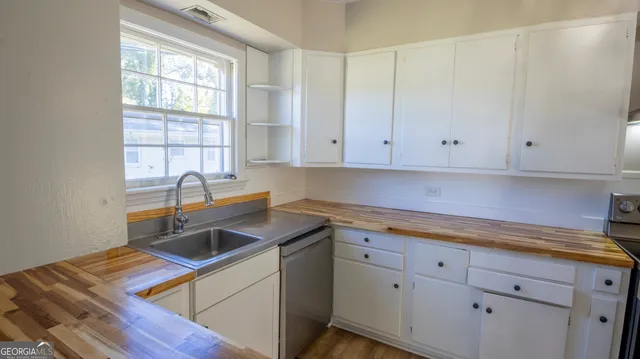 a kitchen with a stove and a refrigerator