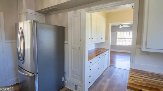 a kitchen with stainless steel appliances granite countertop a stove and a refrigerator