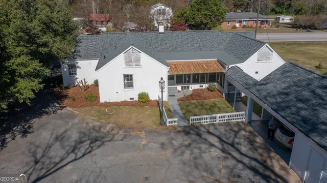 a view of house with a swimming pool