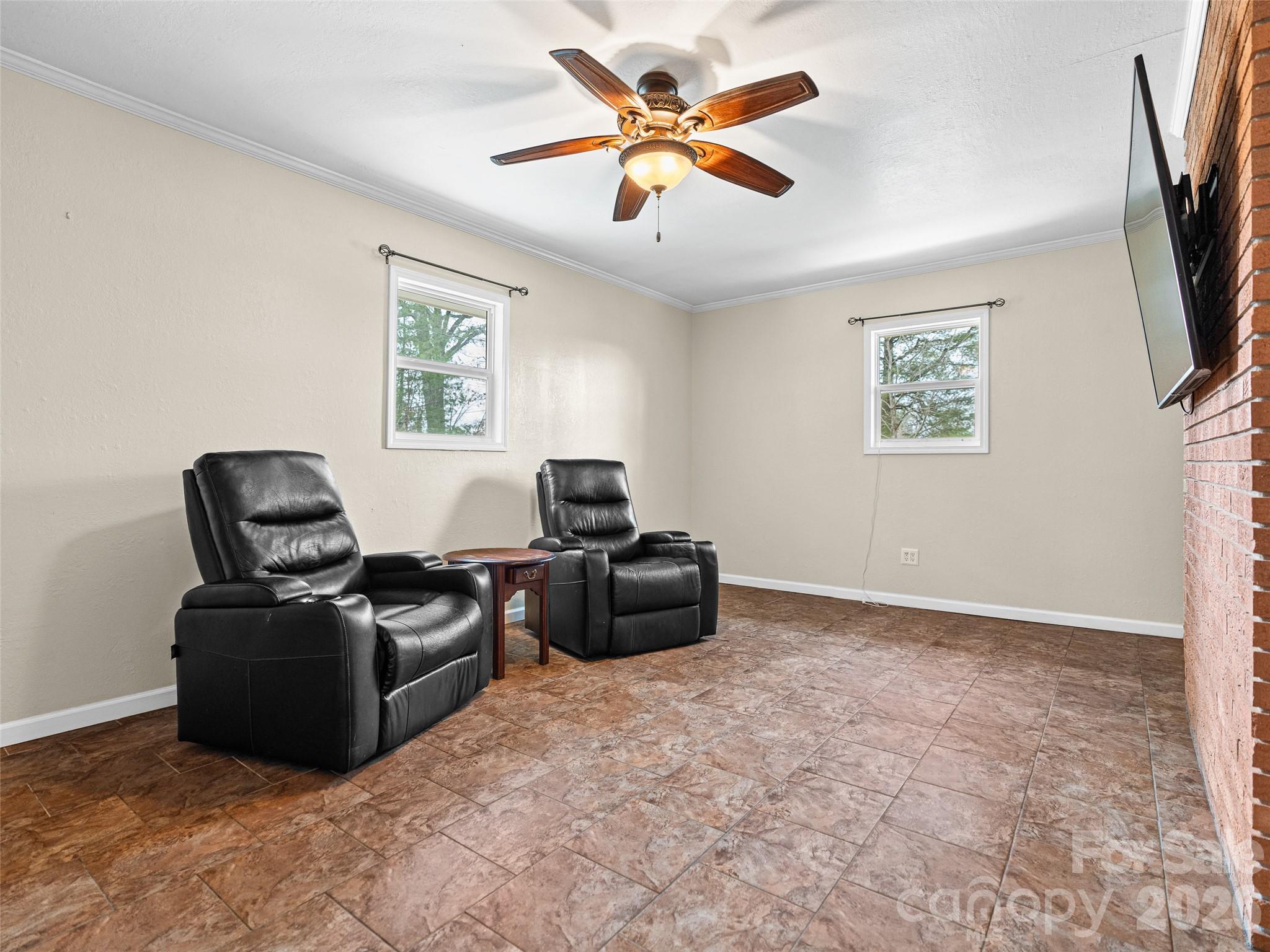 1034 South Orchard Road Flat Rock, NC 28731 - Photo 18 of 30 a living room with furniture and a flat screen tv