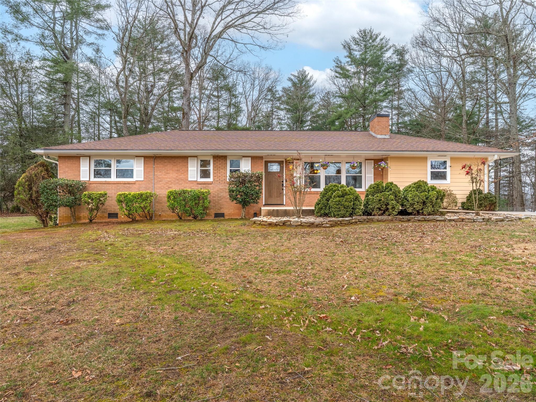 1034 South Orchard Road Flat Rock, NC 28731 - Photo 2 of 30 front view of a house with a yard