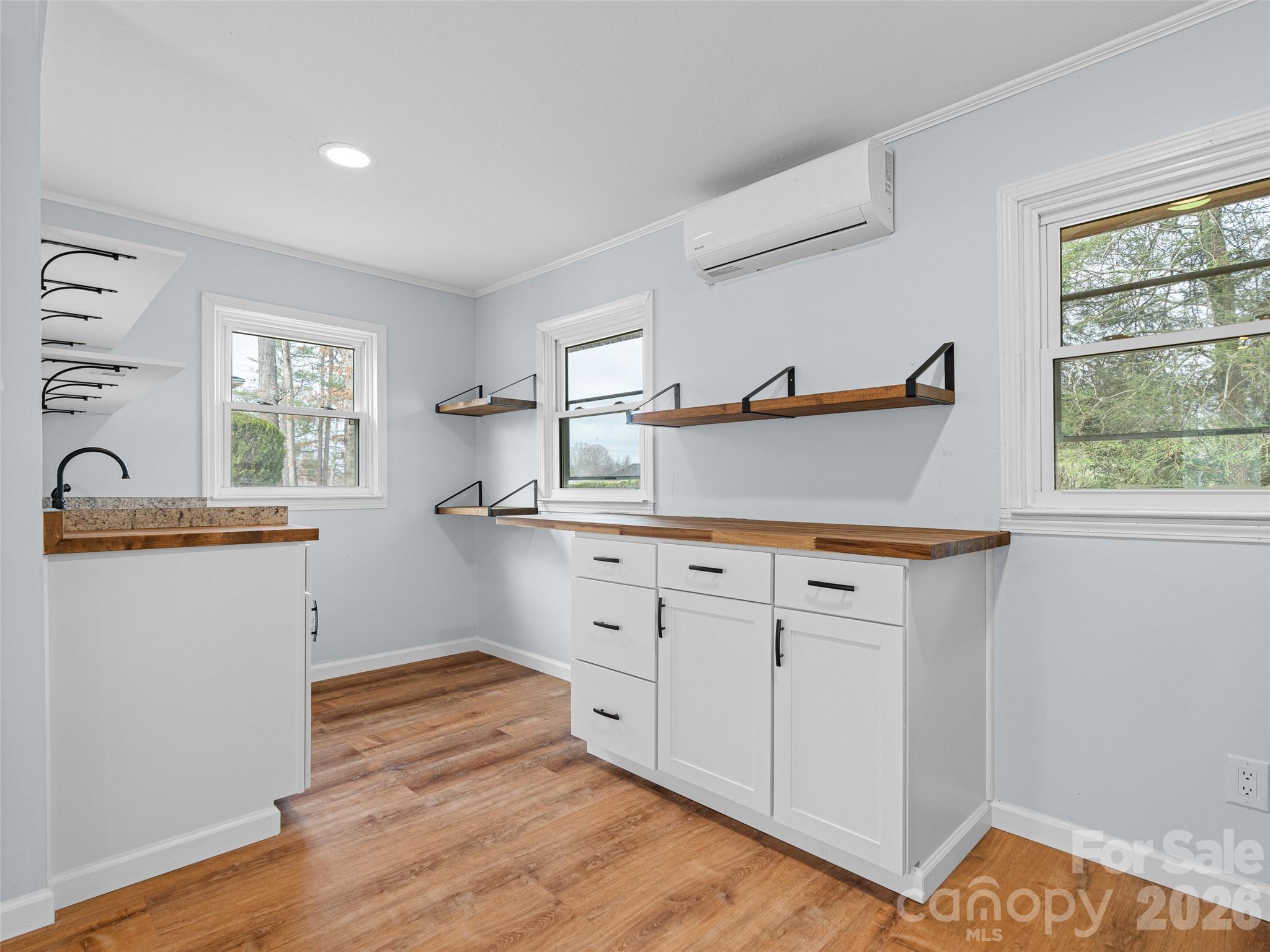 1034 South Orchard Road Flat Rock, NC 28731 - Photo 25 of 30 a view of cabinets a wooden floor and windows