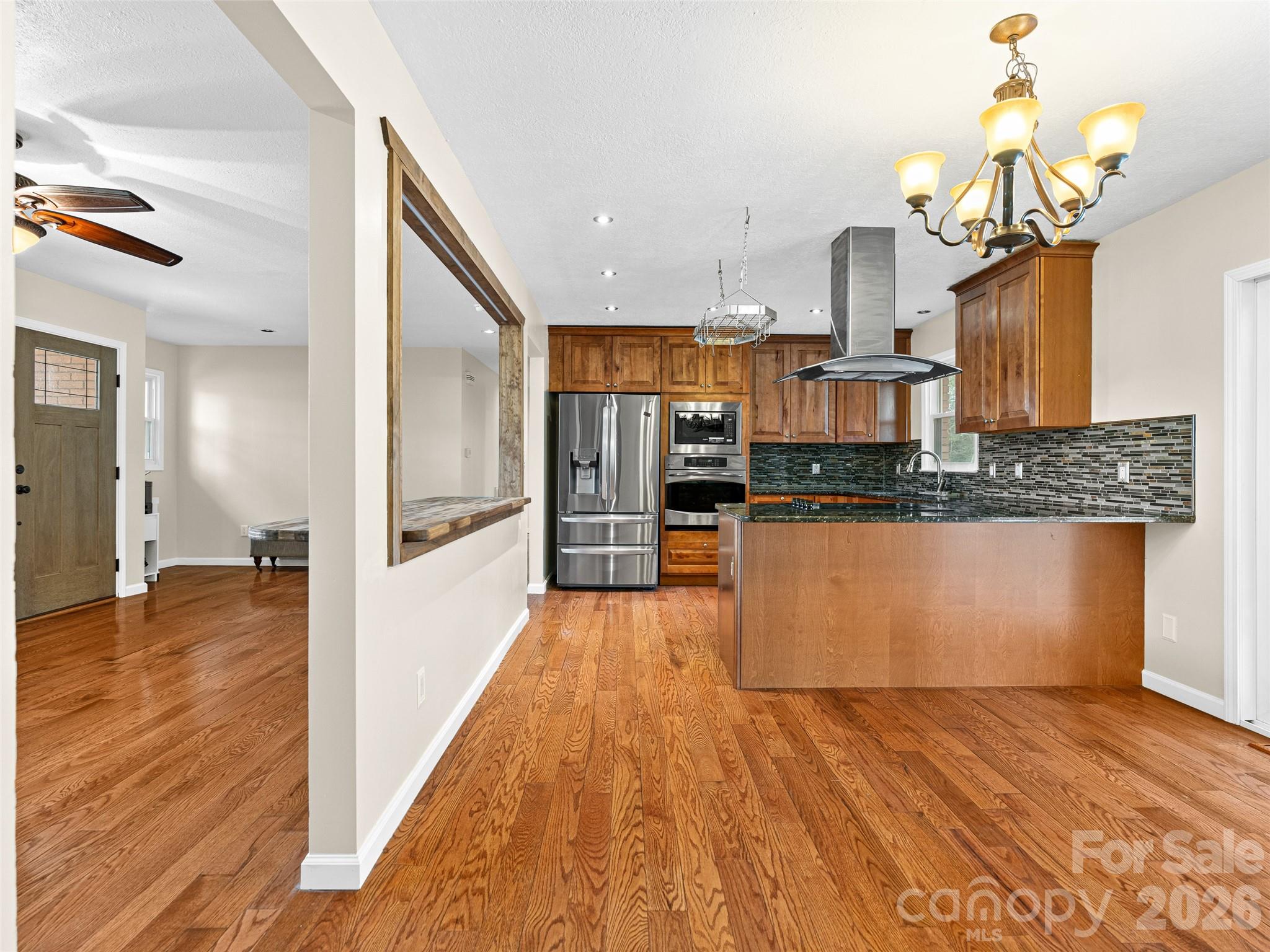 1034 South Orchard Road Flat Rock, NC 28731 - Photo 5 of 30 a view of kitchen with wooden floor