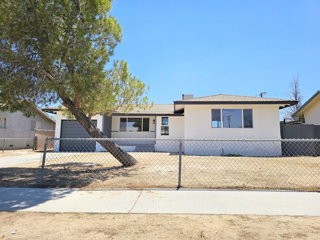 247 West Perdew Avenue Ridgecrest, CA 93555 - Photo 23 of 24 a front view of a house with a yard