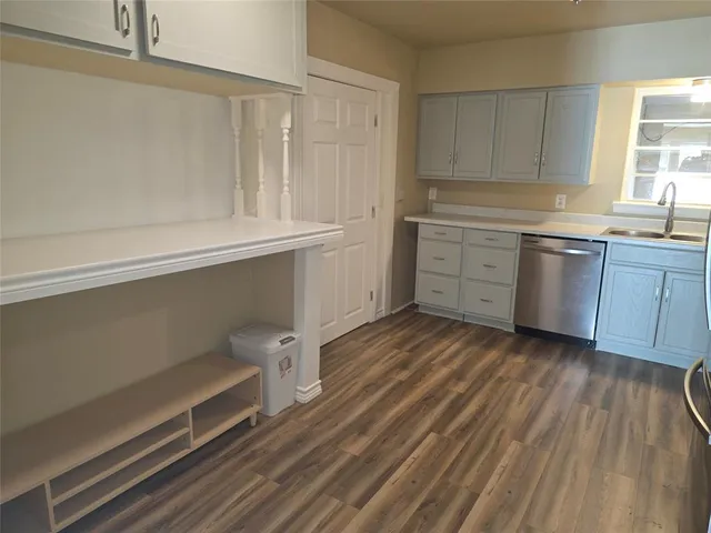 a kitchen with sink cabinets and window