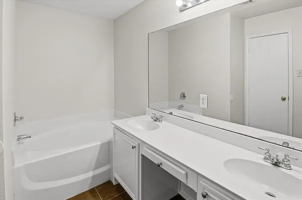 a bathroom with a sink and a bathtub
