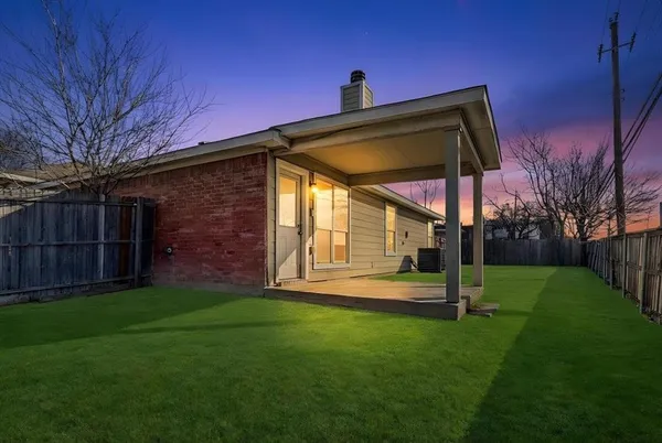 a view of a back yard of the house