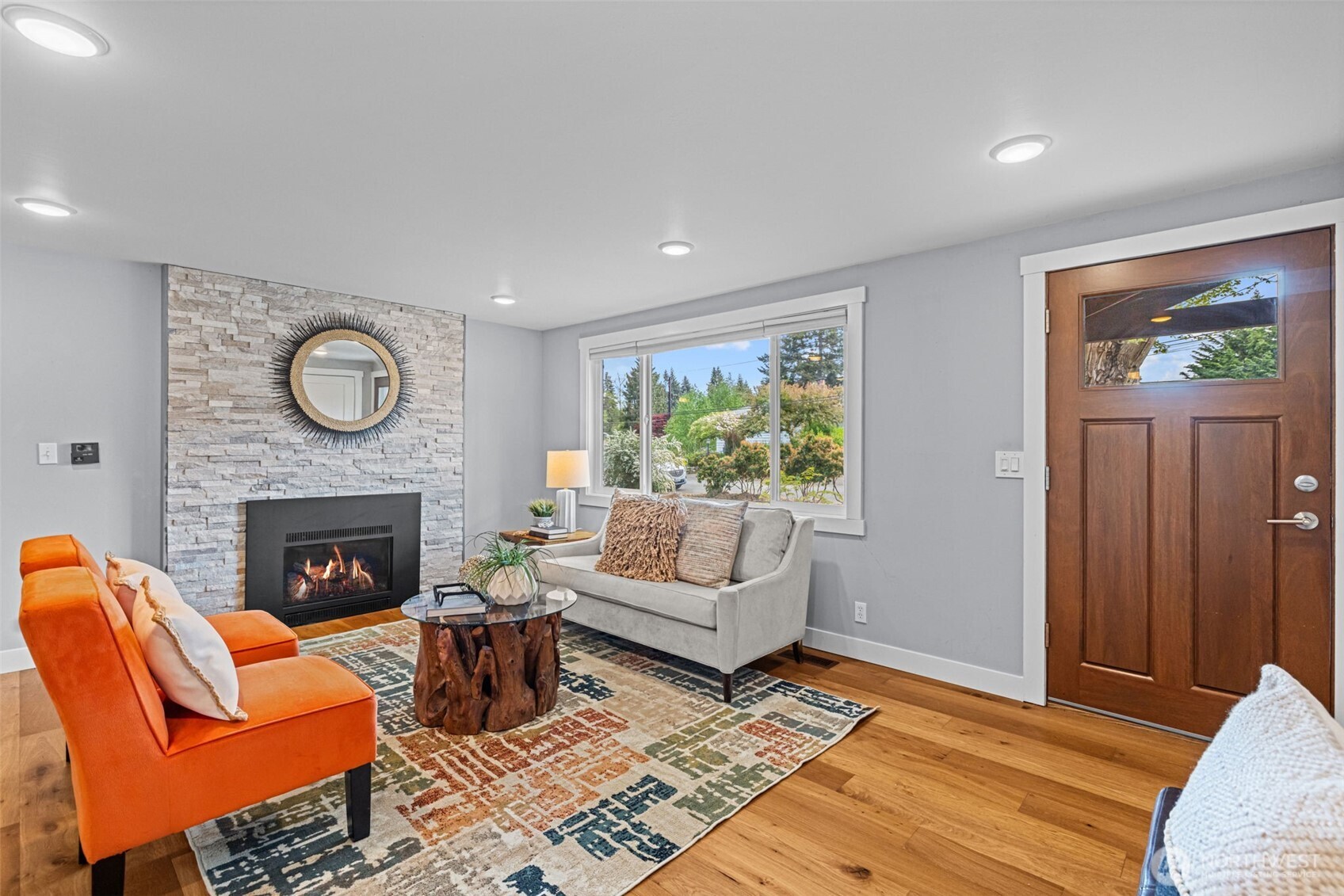 8629 223rd Street Southwest Edmonds, WA 98026 - Photo 8 of 40 a living room with furniture a fireplace and a window