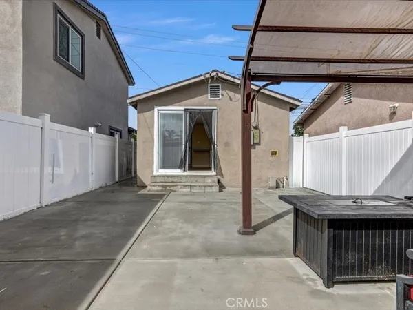 a view of a house with a wooden deck