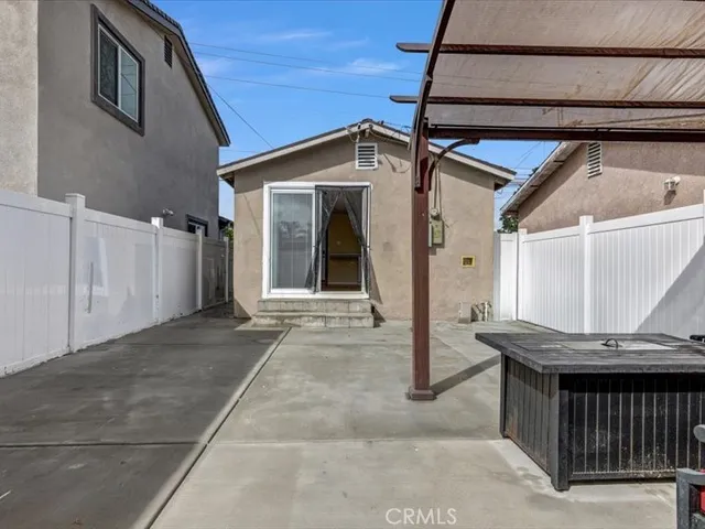 a view of a house with a wooden deck