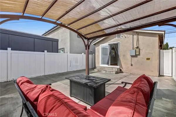a view of a house with a wooden deck