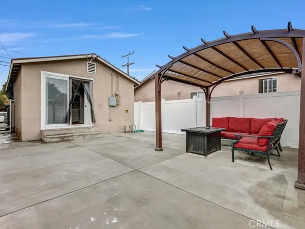 a view of a chair and table in the balcony