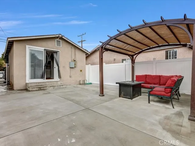 a view of a chair and table in the balcony
