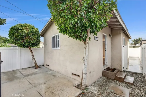 a house view with a wooden fence