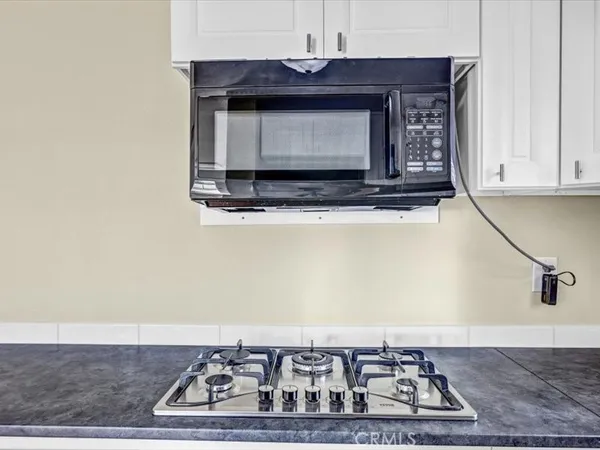 a living room with a fireplace and a counter top