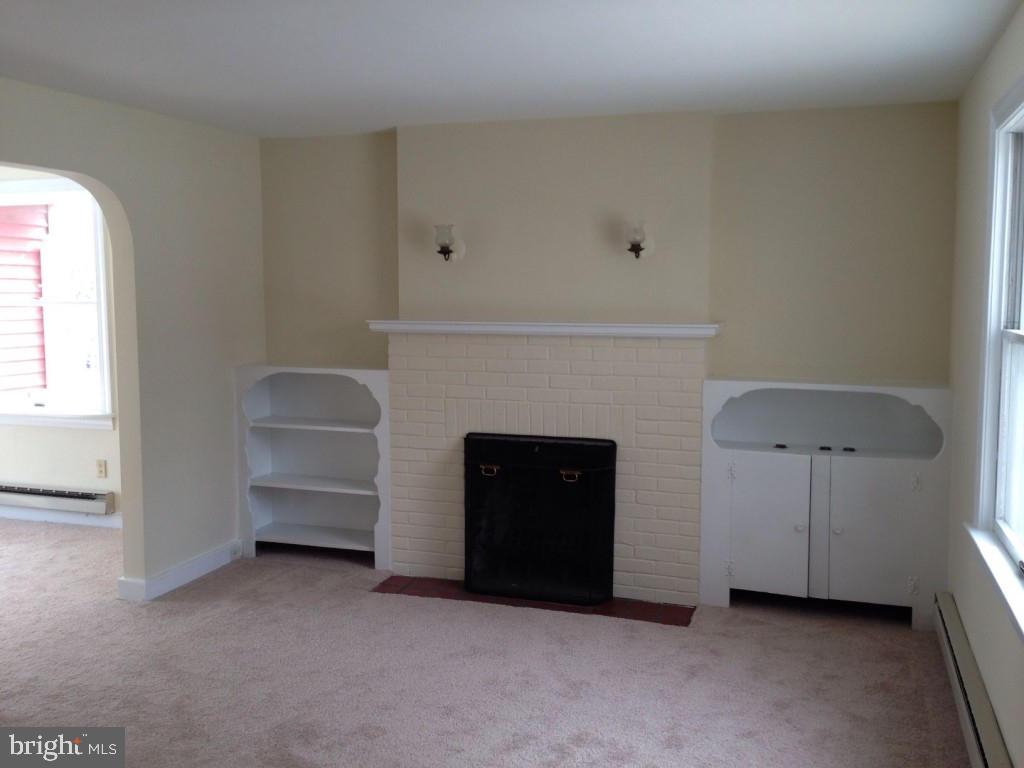 59 Petersburg Road Lancaster, PA 17601 - Photo 5 of 11 a living room with furniture and a fireplace