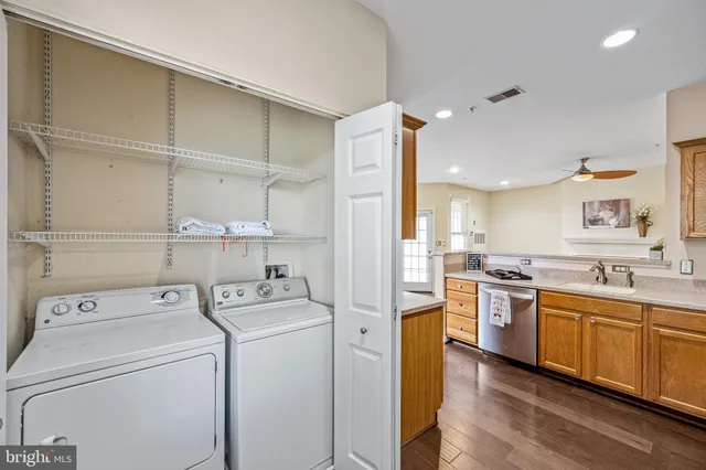 a kitchen with a sink a stove and cabinets