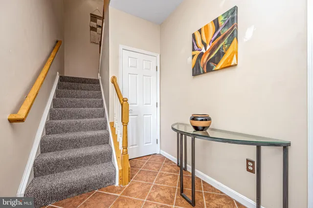 a view of staircase with white walls