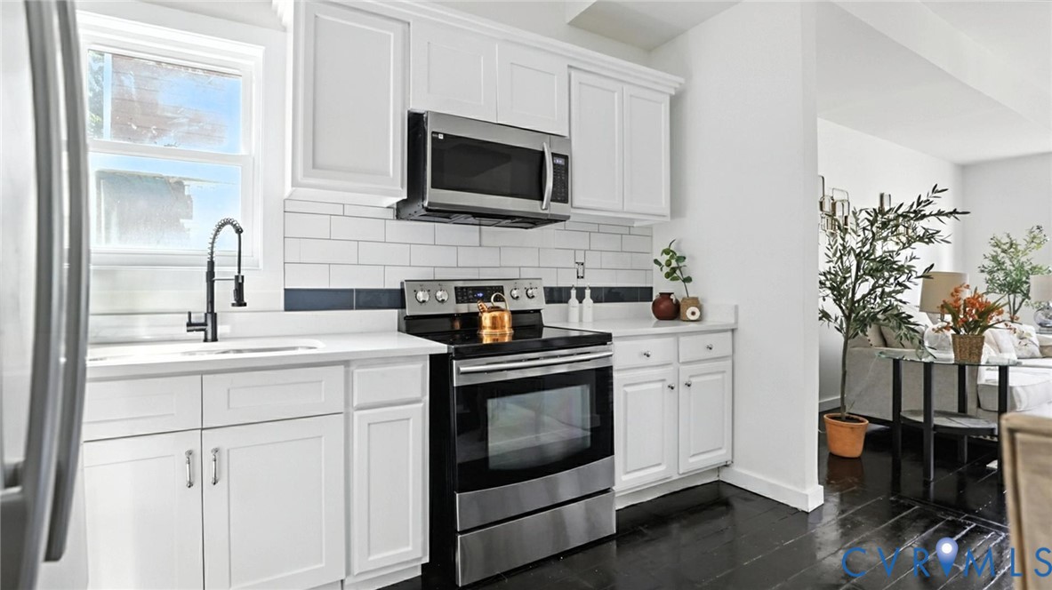 622 Grove Avenue Petersburg, VA 23803 - Photo 11 of 20 a kitchen with a sink stove and microwave