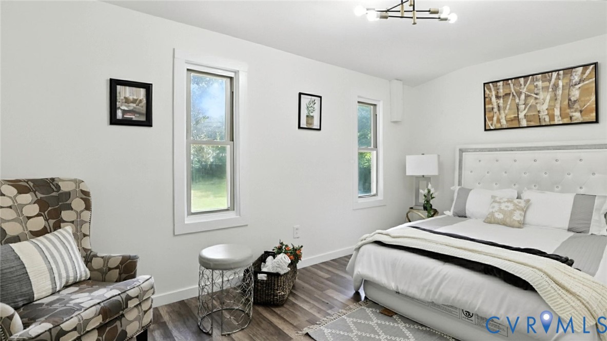 622 Grove Avenue Petersburg, VA 23803 - Photo 12 of 20 a bedroom with a bed and wooden floor
