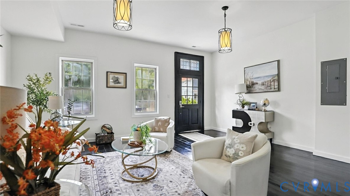 622 Grove Avenue Petersburg, VA 23803 - Photo 5 of 20 a living room with furniture a window and a chandelier