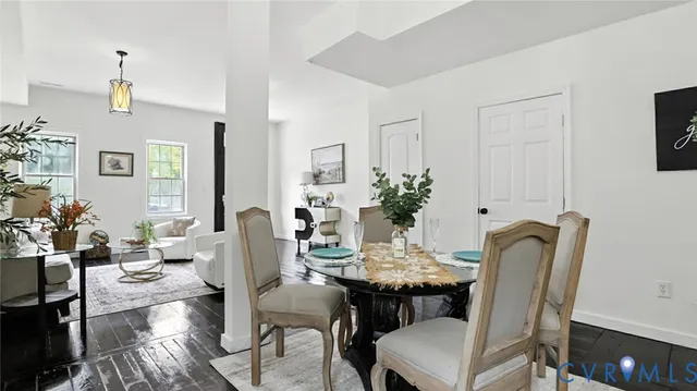 a dining room with furniture and window