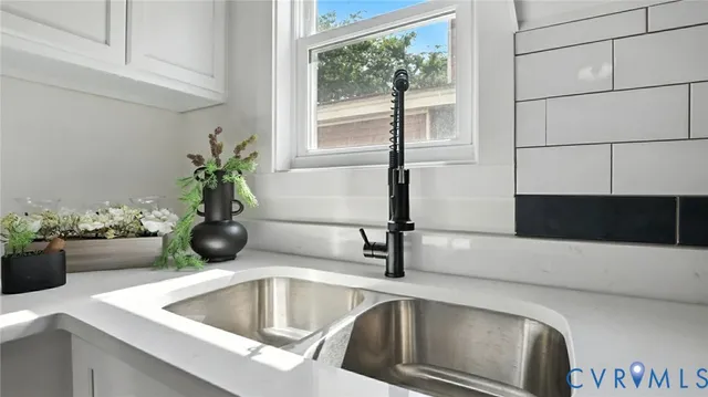 a kitchen with a sink and a window