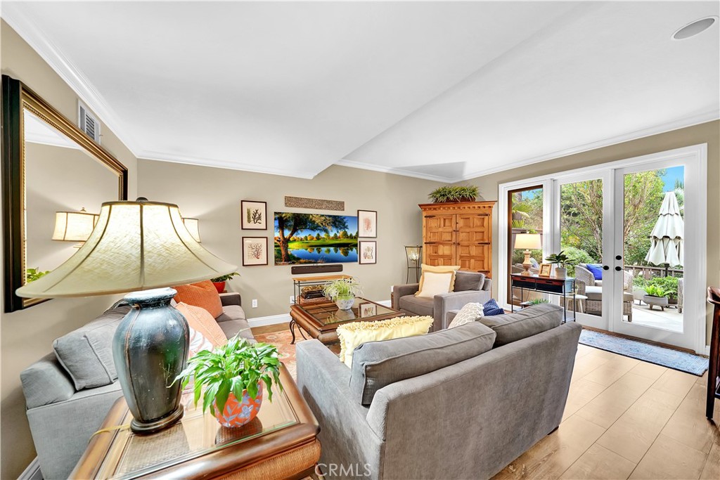 10 Crystal Pool, Unit 39 Irvine, CA 92603 - Photo 11 of 30 a living room with furniture and a large window